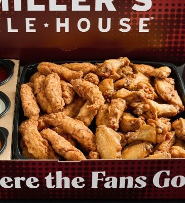 a large red miller's ale house branded box with boneless chicken tenders (zingers) and chicken wings with sauces inside