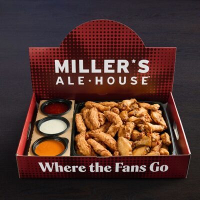 a large red miller's ale house branded box with boneless chicken tenders (zingers) and chicken wings with sauces inside
