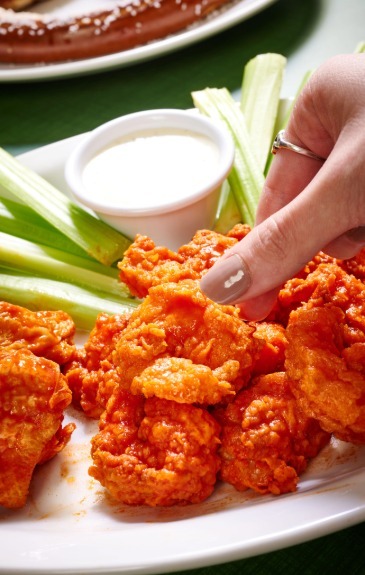 Tossed shrimp in buffalo sauce