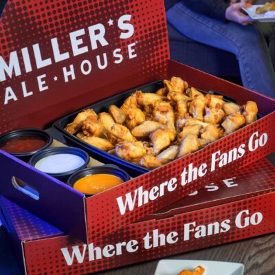 a large red miller's ale house branded box with chicken wings and sauces inside