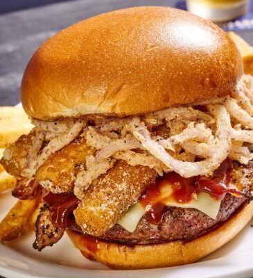 Premium ground beef patty, melted white American cheese, peppered bacon, bbq sauce, 3 Mozzarella Sticks, fried onion tanglers on a toasted bun.