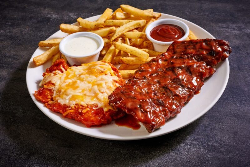 Crispy buttermilk-marinated chicken breast tossed in hot sauce & topped with melted cheese, ½ rack baby back ribs