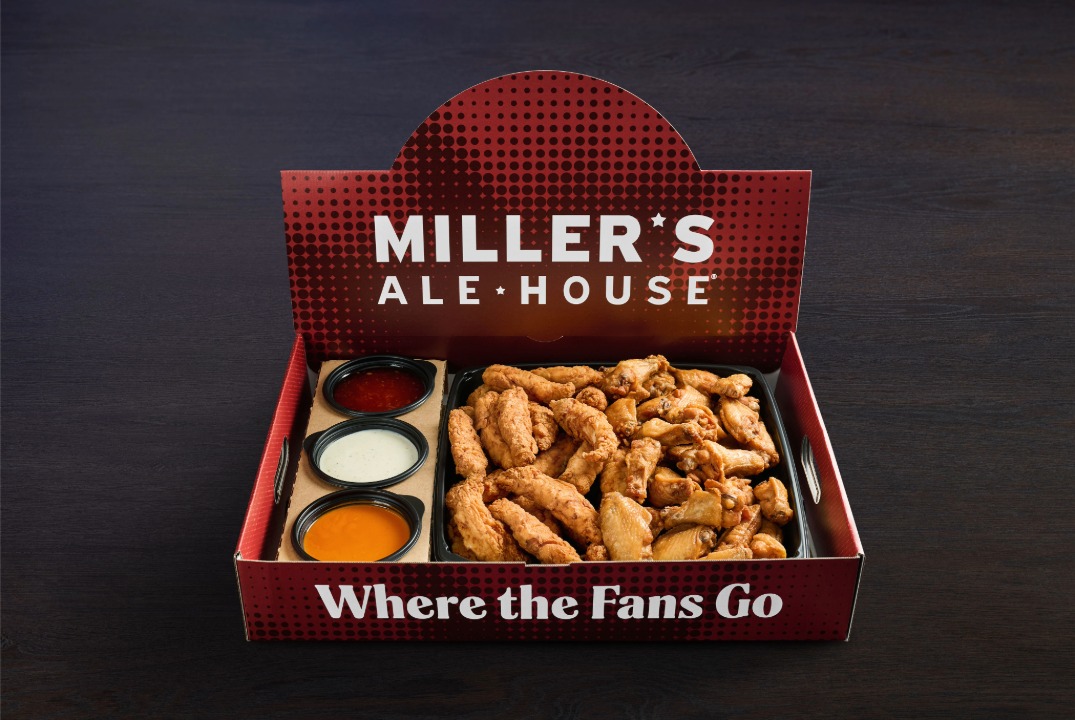 a large red miller's ale house branded box with boneless chicken tenders (zingers) and chicken wings with sauces inside