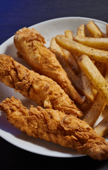 3 count chicken tender zingers on a plate with fries for kids