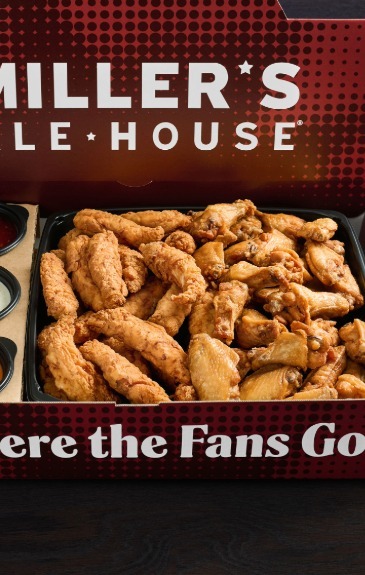 a large red miller's ale house branded box with boneless chicken tenders (zingers) and chicken wings with sauces inside