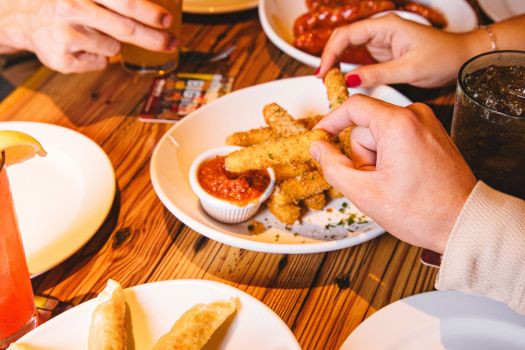 friends sharing mozzarella sticks