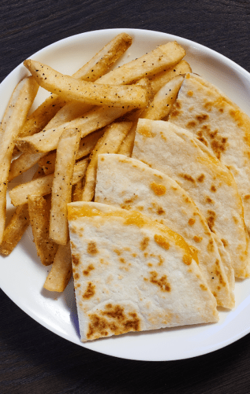 a plate of cheese quesadilla for kids with friends
